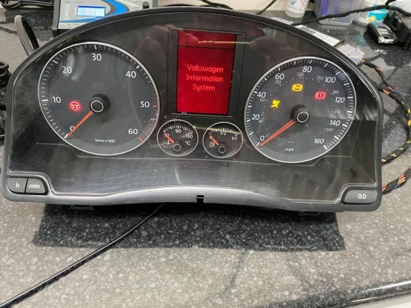 Golf MK5 diesel Highline instrument cluster with Volkswagen Information System on the red display