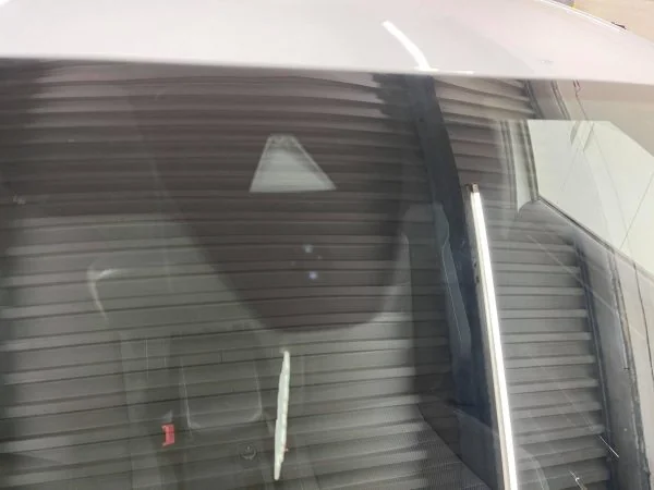 Front assistance camera mounted behind the windscreen near the rear-view mirror
