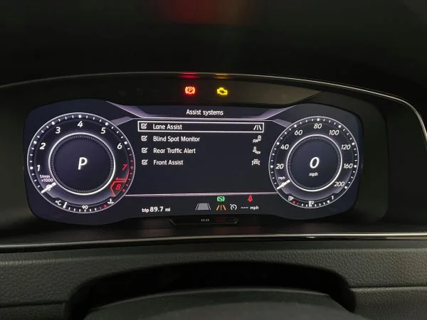Golf digital instrument cluster showing Lane Assist in the assistance systems menu