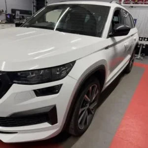 White Škoda SUV at the VW Retrofit workshop