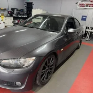 Grey BMW E-Series at the VW Retrofit workshop in Redditch
